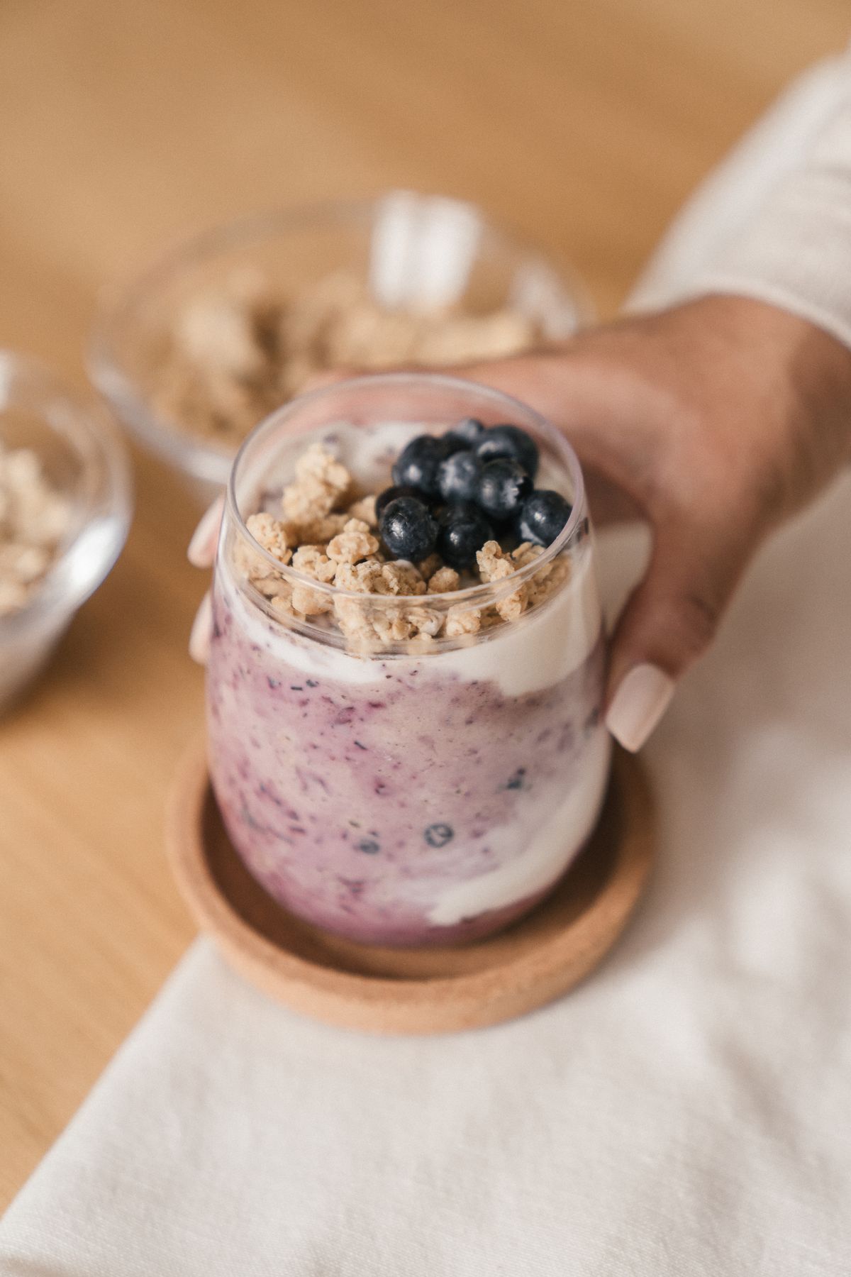 Blueberry yoghurt parfait with granola in a glass