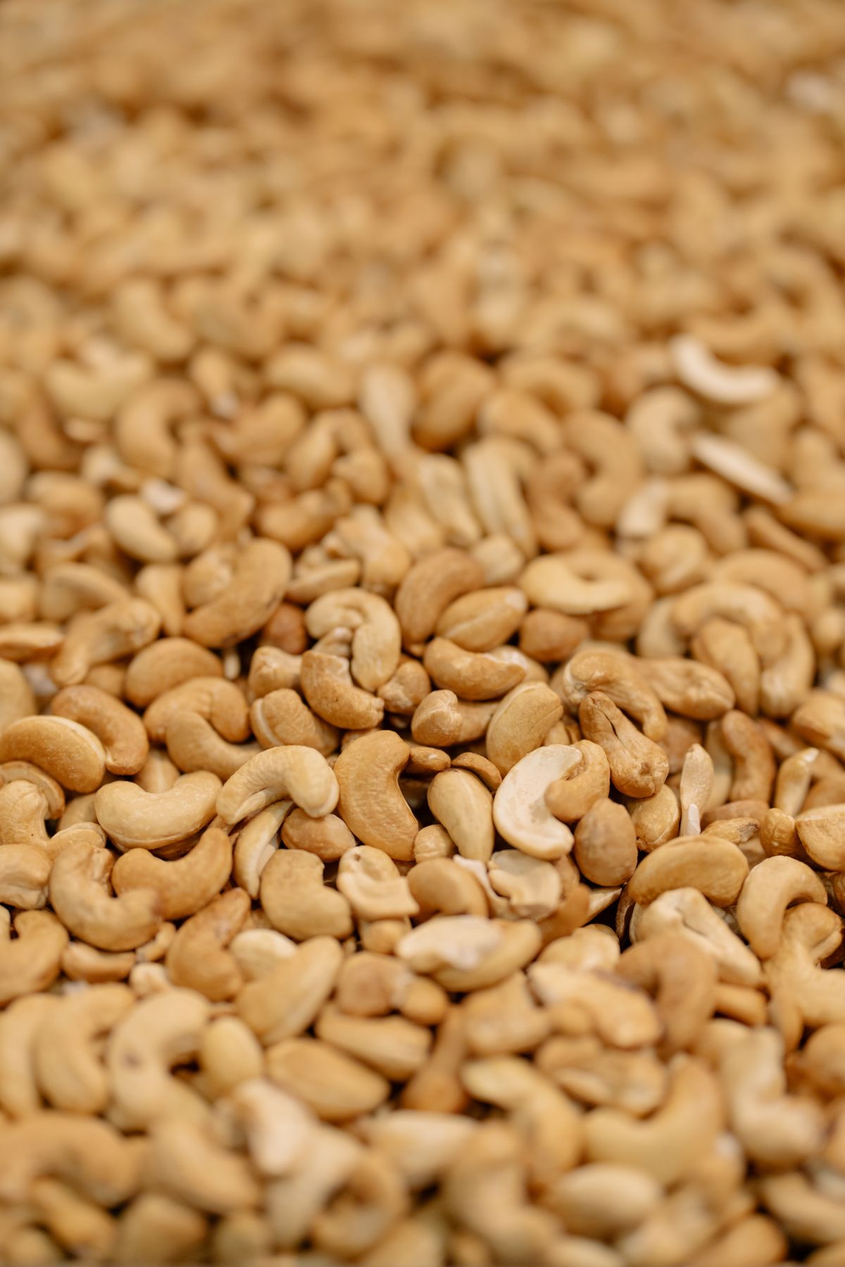 Pale cashew kernels shown close up