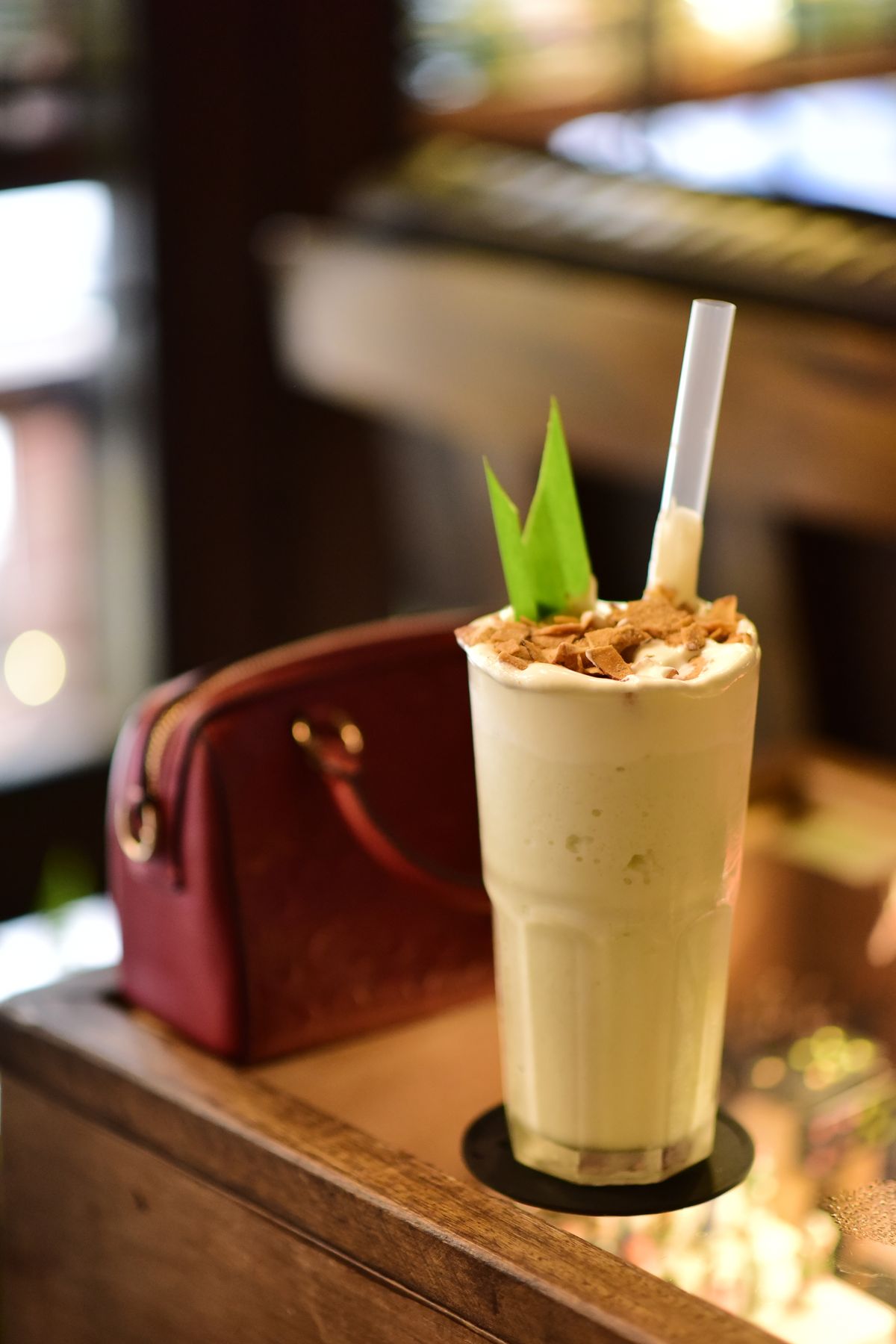 Pale milkshake topped with coconut flakes