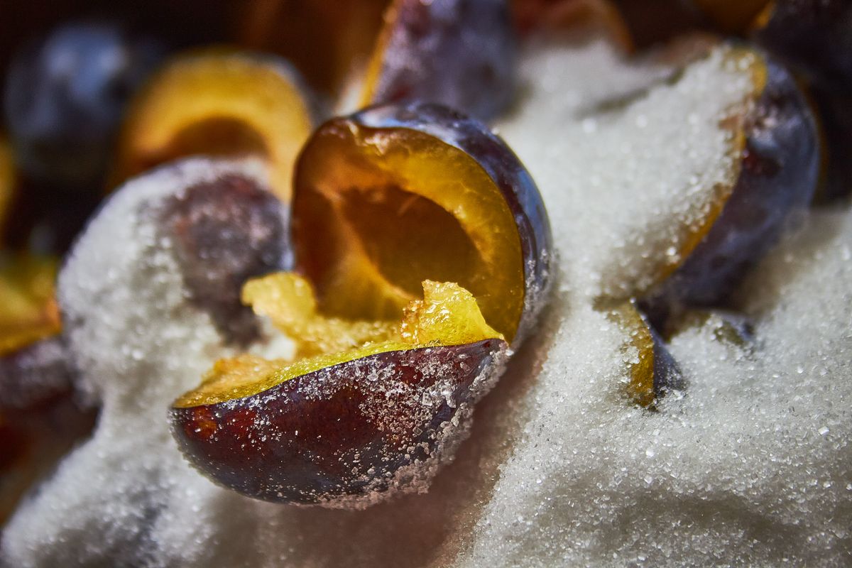 Halved plums lightly dusted with sugar