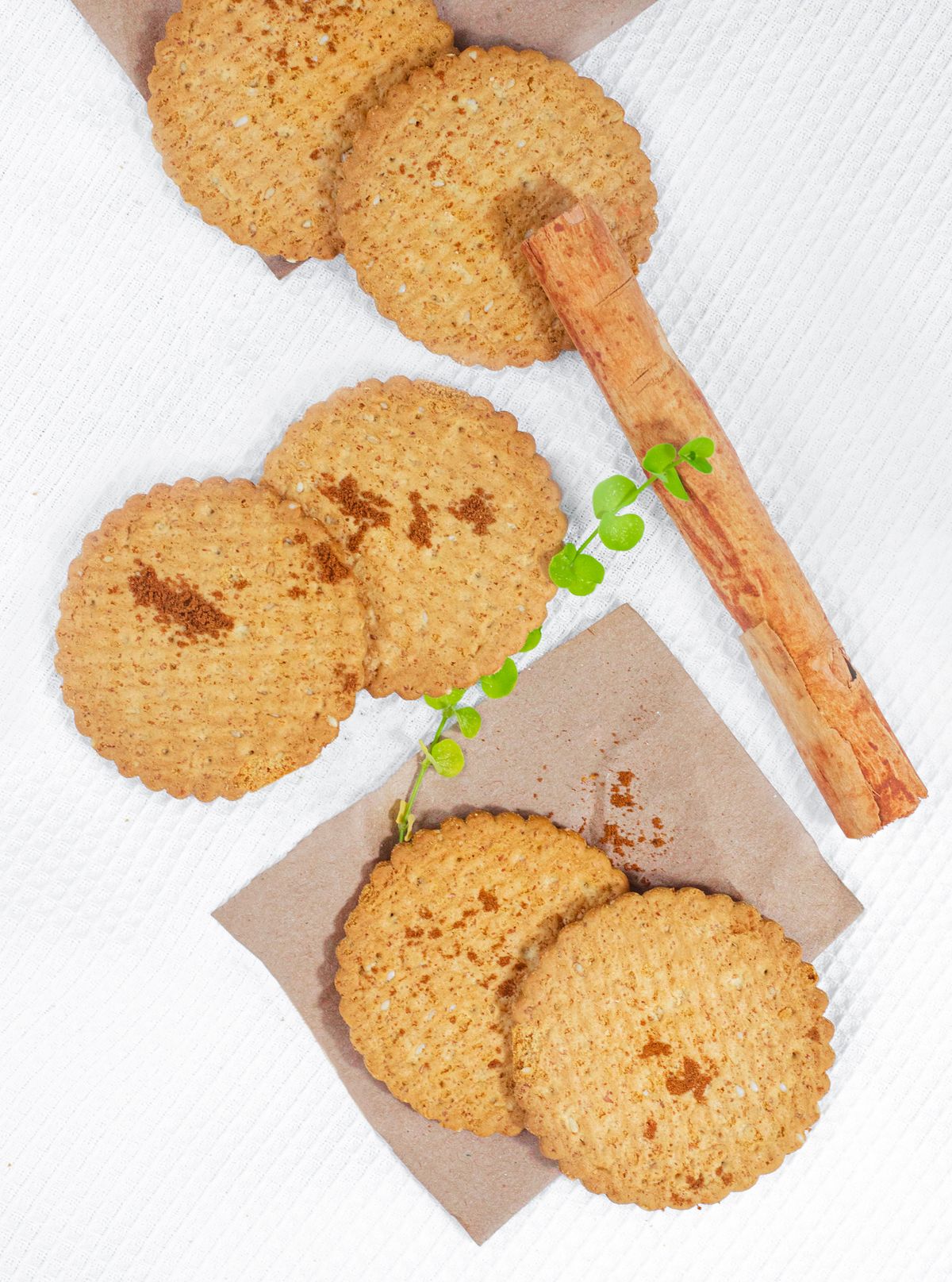 Cinnamon biscuits beside a cinnamon stick