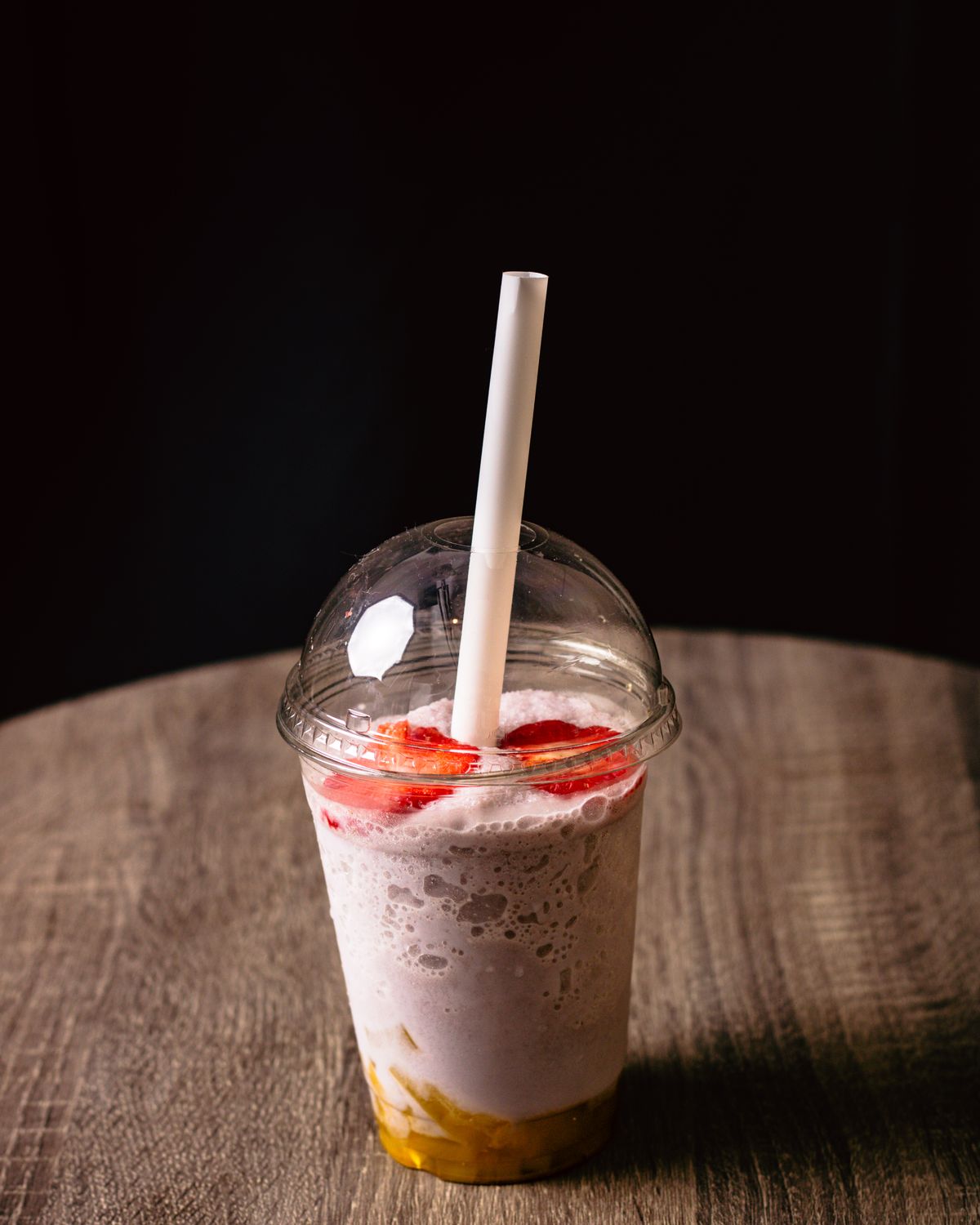 Strawberry banana smoothie in a clear cup