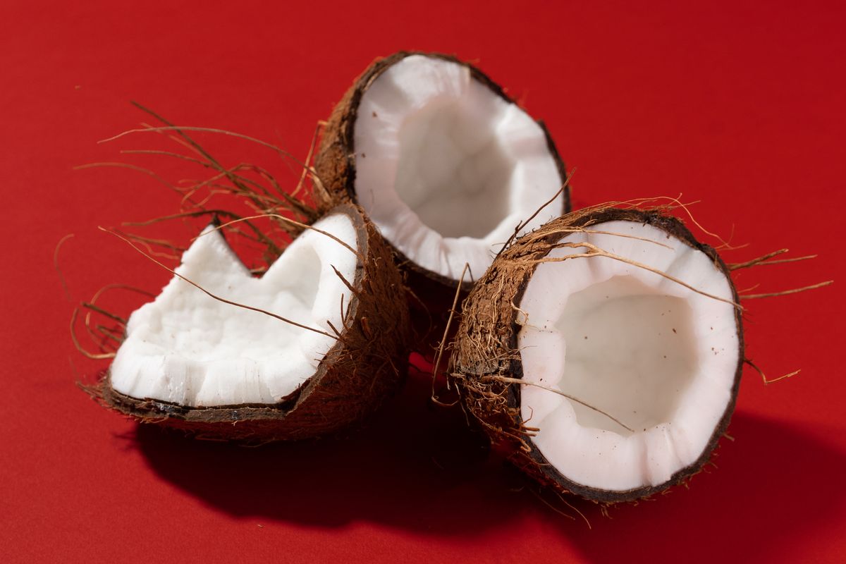 Coconut halves on a red background